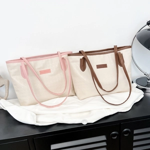 Large minimalist tote bag for women with embossed texture and long leather handles