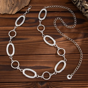 Detailed macro view of silver punk style body chain with adjustable lobster clasp closure