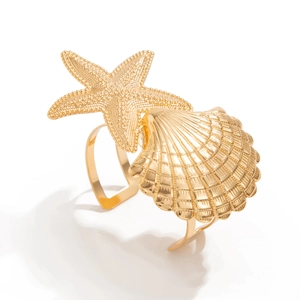 Golden starfish and seashell napkin ring set with textured finish for elegant dining decor