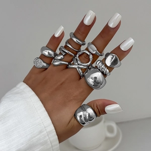 Polished silver liquid metal rings set with irregular drip design on hands