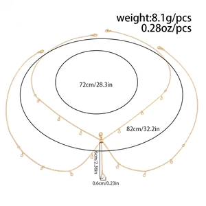 Detailed diagram of gold body chain with layered seashell charms and size measurements