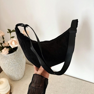 Minimalist black corduroy crescent bag for women with adjustable shoulder strap and zipper