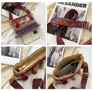 Detail of ethnic crossbody bag with colorful tassels, wide strap and internal capacity