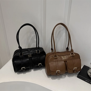 Retro faux leather bowling bag in black and brown with front pockets for daily commute