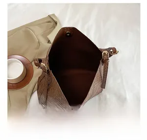Top view of spacious brown woven bucket bag interior showing texture and magnetic closure