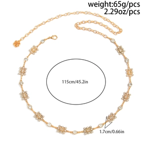 Detail of vintage geometric square gold waist chain with rhinestones and size labels