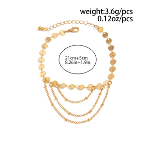 Detail view of gold layered anklet with round discs, measuring 21cm plus 5cm extender