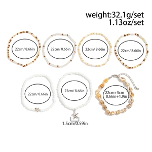 Detail of 7-piece bohemian anklet set featuring starfish, turtle charms and seashells