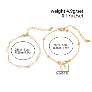 Detail of 4.9g gold bow pendant bead chain and pearl anklet set with 5cm extension