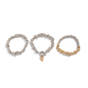 Three-piece metal bracelet set with irregular silver beads and golden heart pendant