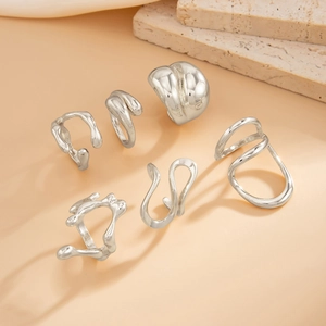 Set of six irregular liquid metal silver rings with polished molten lava aesthetic