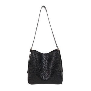 Minimalist black woven leather shoulder bag with a sleek finish on a white background