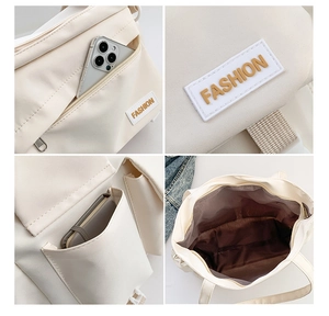 Détails de la structure multi-poches et de la doublure intérieure du sac cabas blanc crème