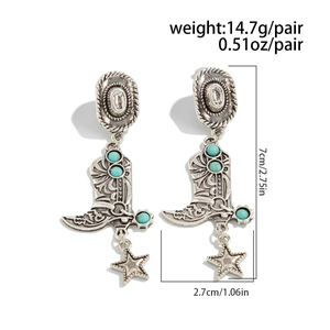 Detail view of western cowboy style hat and boot earrings with turquoise beads
