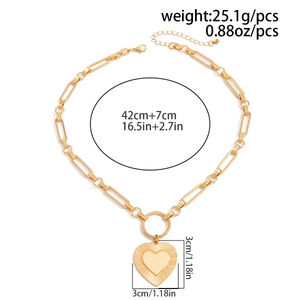 Detailed view of gold chunky chain heart necklace showing length and weight measurements