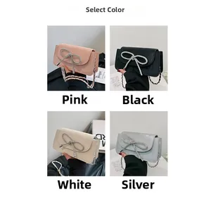 Detailansicht der Trendtaschen mit Strass-Schleifen in den Farben Rosa, Schwarz und Silber