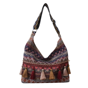 Ethnic bohemian crossbody bag with colorful fringe and patterned wide shoulder strap