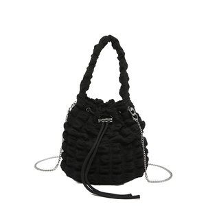 Black pleated bucket bag with popcorn texture, drawstring closure and silver chain strap