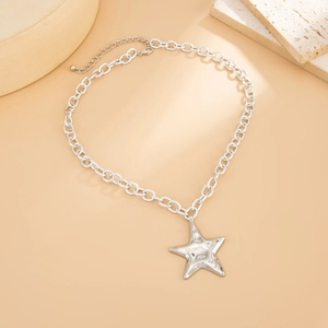 Silver irregular hammered star pendant necklace with chunky links on stone decor