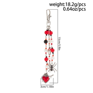 Detailed view of Gothic beaded pendant with spider charm and red beads, 15cm length