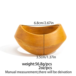 Detailed view of the irregular wave edge and natural wood grain on a 6.8cm diameter bowl