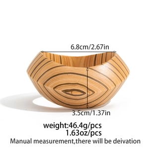 Detail view of a wide wooden bangle with organic wood grain and dimensional specs