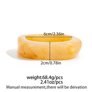 Detail view of amber marble resin bracelet with 6cm inner diameter and 2cm width specs