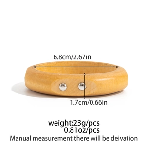 Detailed size specifications of natural wooden bangle with silver stud accents