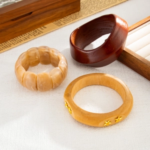 Three-piece ethnic resin bracelet set with marble beads and star rivet details