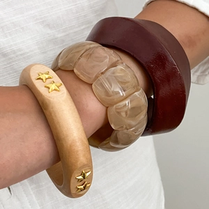 Ethnic style stackable bracelet set with wood, amber resin, and lacquered finish