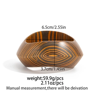 Detail of vintage wooden bangle showing concentric wood grain texture and 6.5cm inner diameter