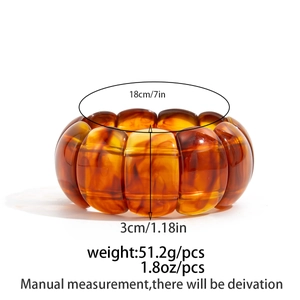 Detail view of amber resin chunky bracelet showing 3cm width and 18cm circumference measurements