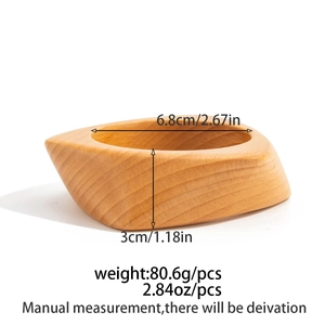 Macro shot of vintage irregular geometric wooden bracelet with natural wood grain detail