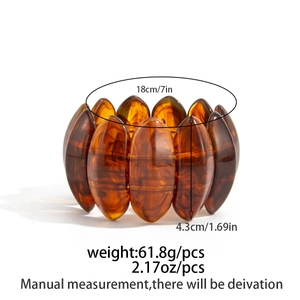 Detailed view of wide amber resin stretch bracelet with geometric faceted beads
