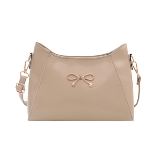 Elegant beige bow shoulder bag with gold hardware and crescent shape for women