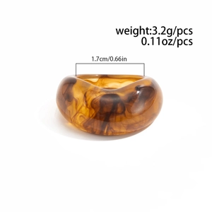 Macro view of thick resin ring showing amber tortoise texture and inner diameter scale