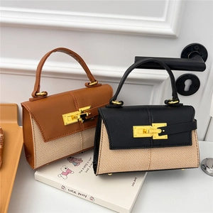 Mini borse bicolore stile Kelly in pelle marrone e nera con chiusura girevole dorata