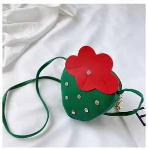 Detail shot of strawberry flower purse with white rivets and gold zipper pendant decoration