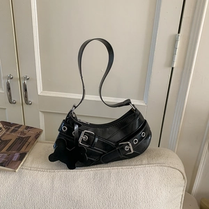 Chic black patent leather underarm bag with oversized silver buckle and butterfly charm