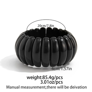 Detailed view of wide black marble resin bracelet with 4cm width and 85g weight specs