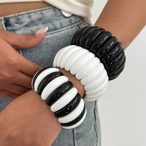 Three-piece chunky resin bangles with black and white wavy geometric patterns