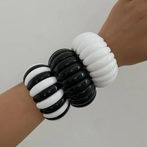 Chic irregular black and white spiral bangles set with glossy resin texture for women