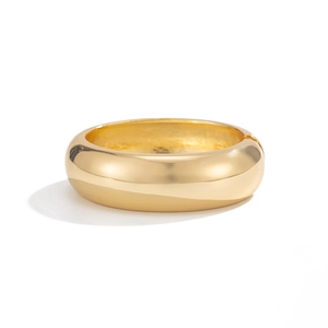 Bracciale rigido bombato dorato lucido con design minimalista e finitura a specchio
