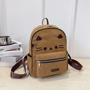 Brown cat-themed leather backpack with ears and whiskers in a lifestyle setting