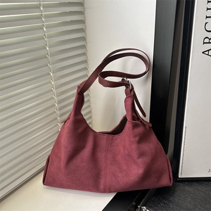 Retro burgundy suede hobo bag with adjustable strap and minimalist stitching for women