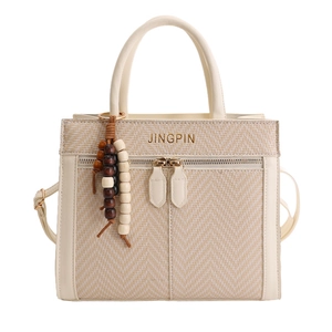 Creamy white vintage style crossbody square bag with woven texture and bead charm