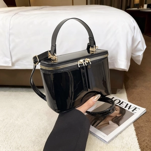 Elegant black patent leather box bag with gold zipper and chain strap for women