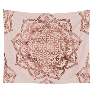Detail of rose gold mandala and flower of life pattern on soft bohemian wall tapestry