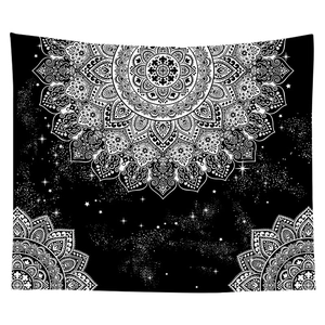 Detailed view of black and white mandala tapestry with starry night sky patterns