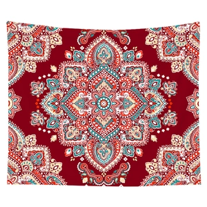 Detail showing the intricate bohemian red mandala print and paisley patterns on fabric